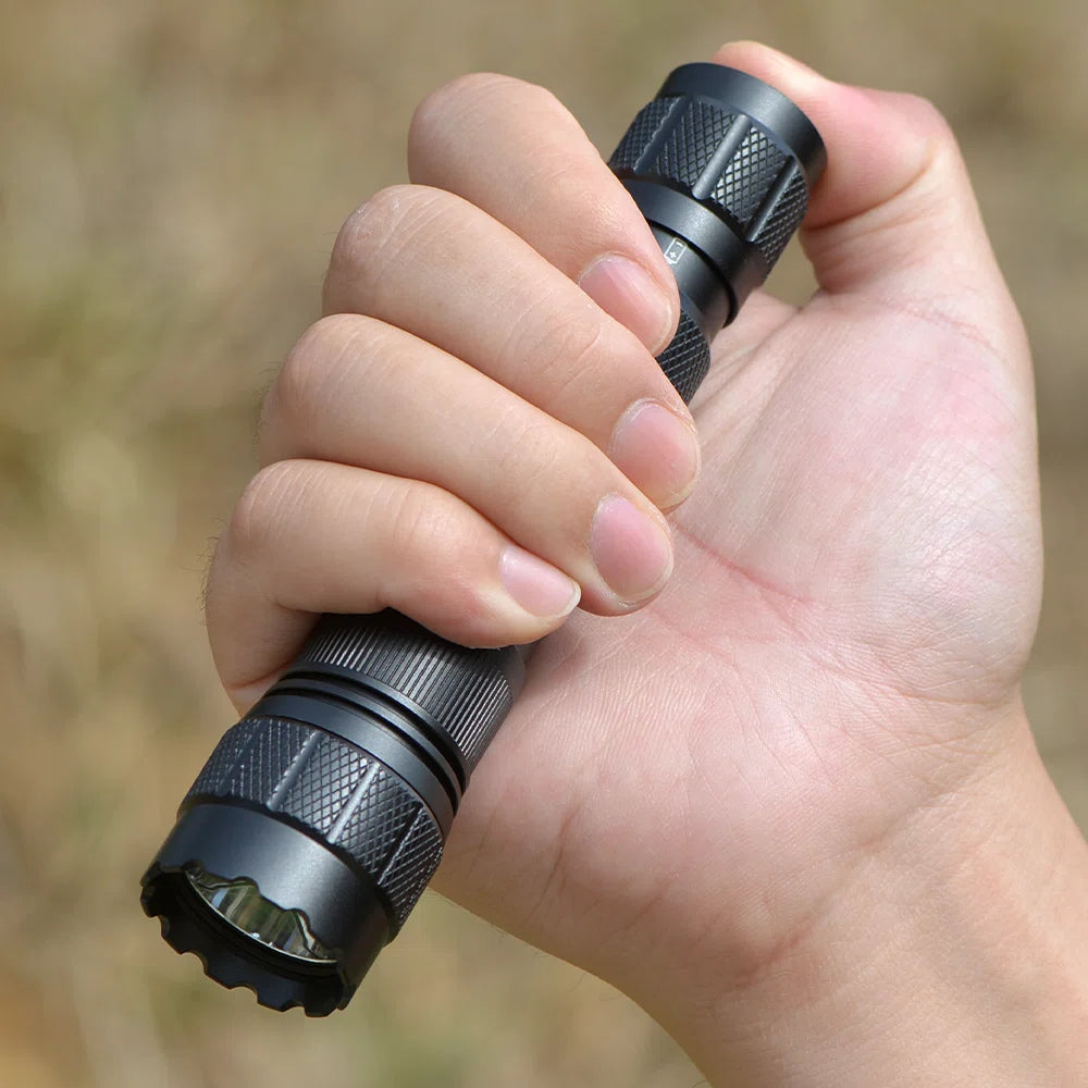 FIELDLUME TAC10-PRO compact torch held comfortably in one hand outdoors