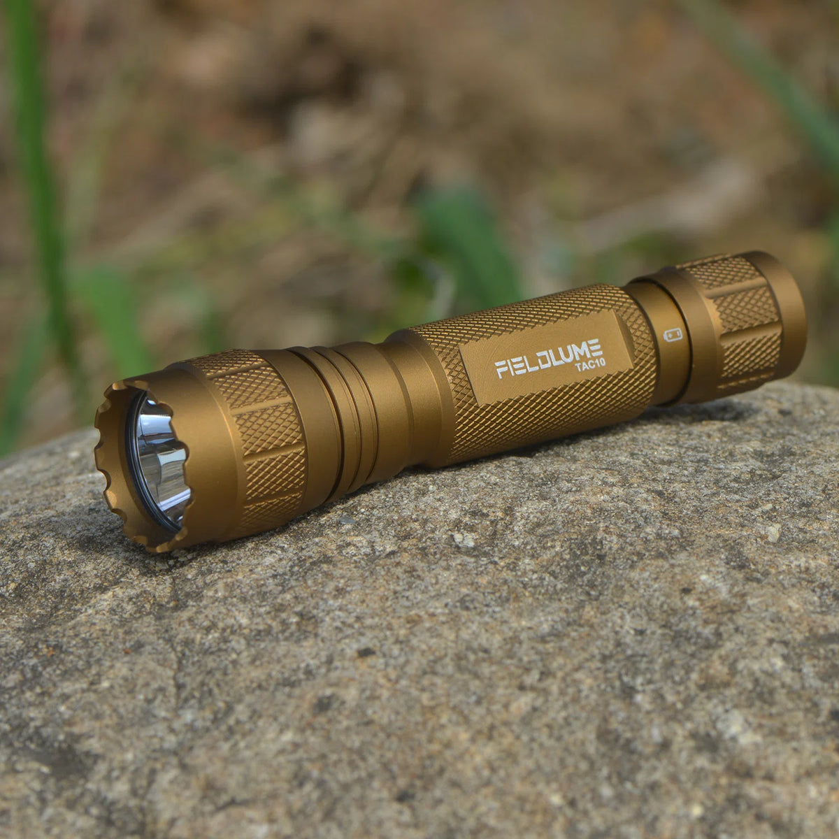 FIELDLUME TAC10 Tan flashlight outdoor angled view